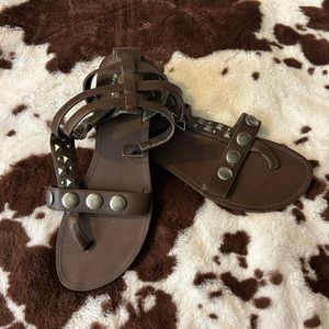 Brown sandals with metal accent